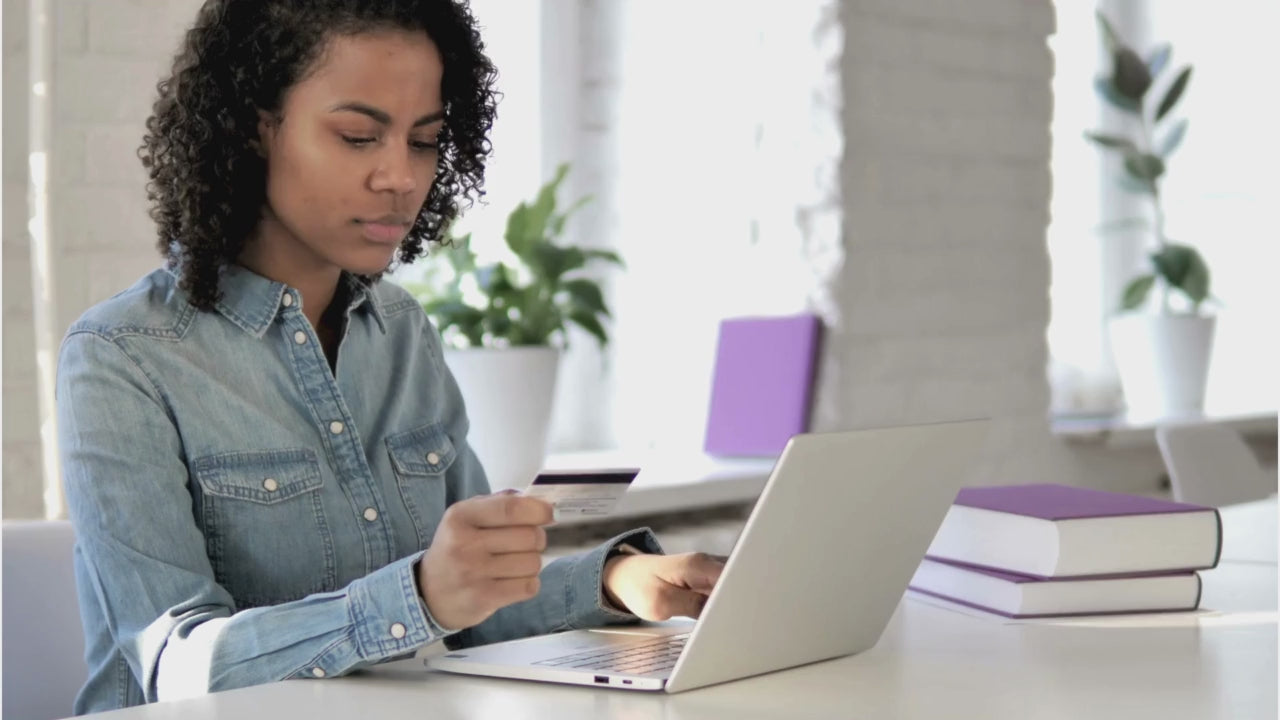 Load video: A customer making a purchase online using her computer